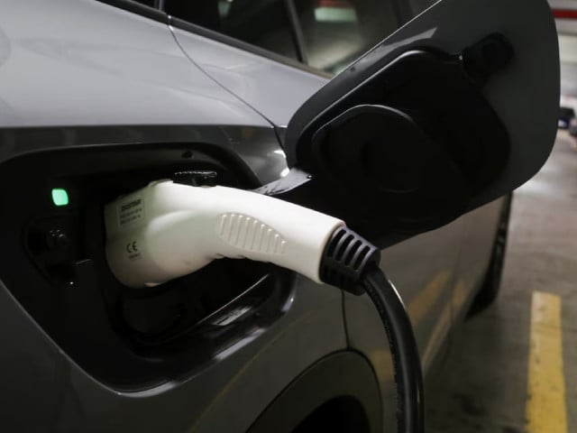 a charging handle recharges an electric vehicle parked at a charging station in baltimore maryland u s march 23 2023 photo reuters